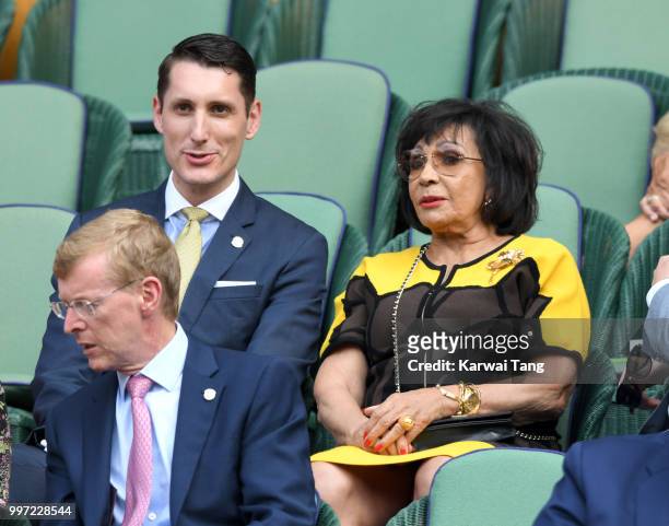 Sebastian Knoerr and Dame Shirley Bassey attend day ten of the Wimbledon Tennis Championships at the All England Lawn Tennis and Croquet Club on July...