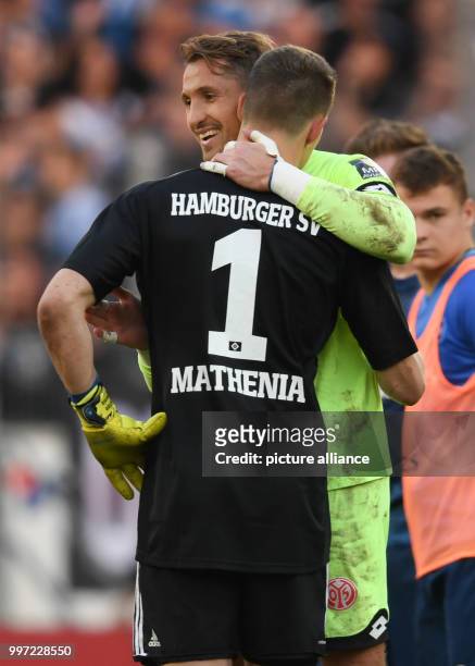 Mainz's goalkeeper René Adler hugging Hamburg's goalkeeper Christian Mathenia after the German Bundesliga soccer match between 1. FSV Mainz 05 and...