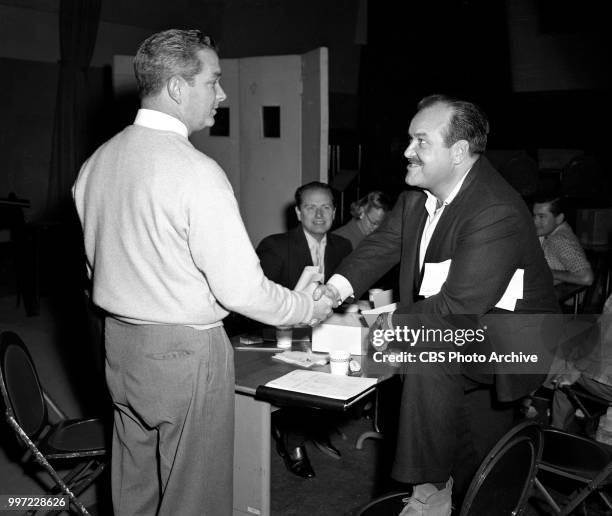 Radio western drama, Gunsmoke. Los Angeles, CA. Left to right: producer Norman Macdonnell and William Conrad . January 19, 1957.