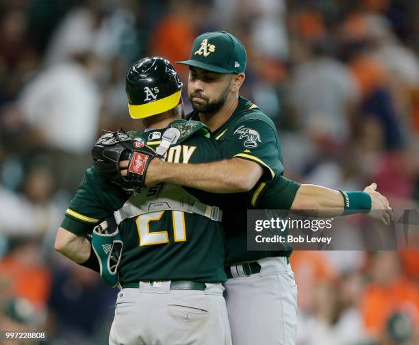 Jonathan Lucroy of the Oakland Athletics hugs Lou Trivino afetr the final out against the Houston Astros at Minute Maid Park on July 12, 2018 in...