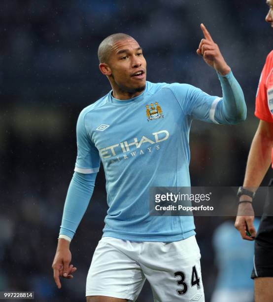Nigel De Jong of Manchester City argues with Referee Andre Marriner during the Barclays Premier League match between Manchester City and Bolton...