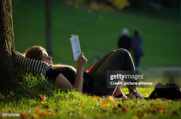 Jana lying on the grass and enjoying the friendly autumn weather with temperatures that at times exceeded 20 degrees Celsius at the Burgerpark in...