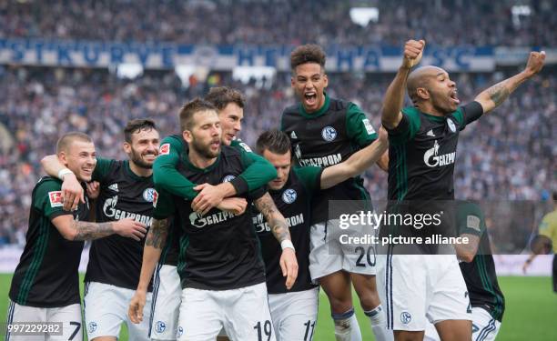 Schalke's Max Meyer, Daniel Caligiuri, goal scorer Guido Burgstaller, Leon Goretzka, Yevhen Konoplyanka, Thilo Kehrer and Naldo celebrate the 2-0...