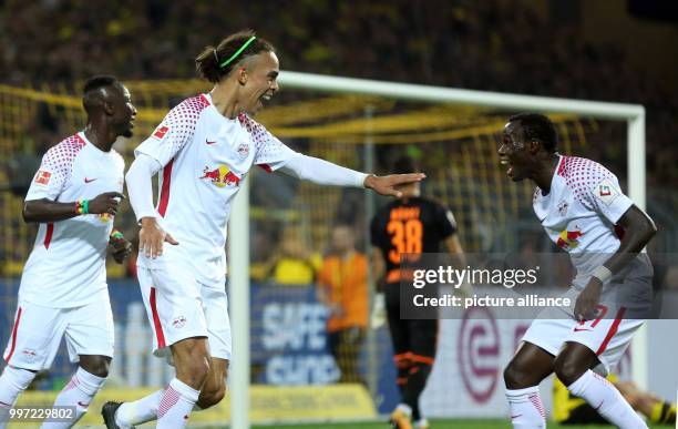 Leipzig's goal scorer Yussuf Poulsen und Bruma celebrate the 1-2 goal during the German Bundesliga soccer match between Borussia Dortmund and RB...