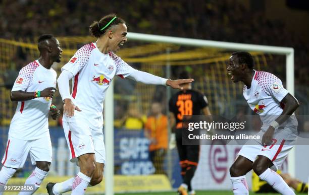 Dpatop - Leipzig's goal scorer Yussuf Poulsen und Bruma celebrate the 1-2 goal during the German Bundesliga soccer match between Borussia Dortmund...