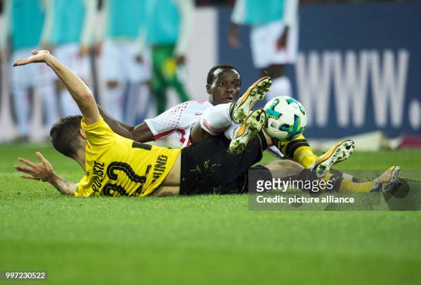 Dortmund's Christian Pulisic and Leipzig's Bruma vying for the ball during the German Bundesliga soccer match between Borussia Dortmund and RB...