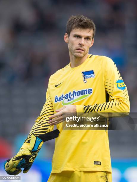 Berlin goalkeeper Rune Jarstein taking his gloves off at the final whistle of the German Bundesliga soccer match between Hertha BSC and FC Schalke 04...