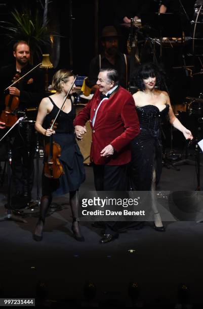Satu Vanska, Barry Humphries and Meow Meow bow during the press night performance of "Barry Humphries' Weimar Cabaret" at The Barbican Centre on July...