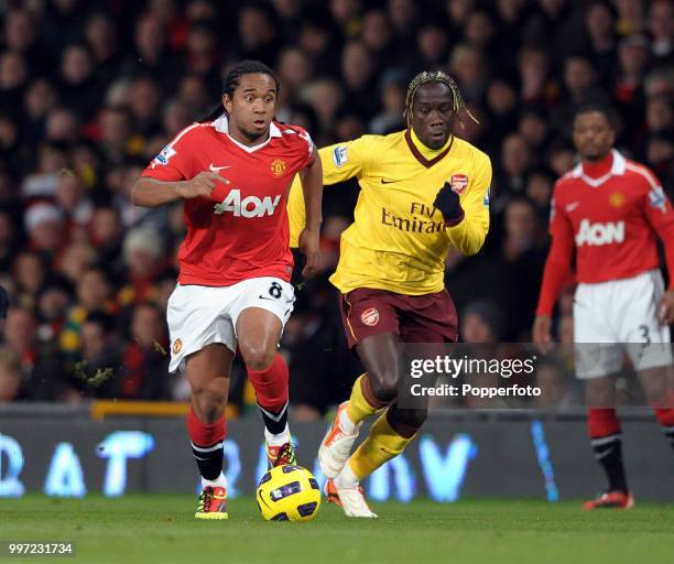 Bacary Sagna of Arsenal chases Anderson of Manchester United during a Barclays Premier League match at Old Trafford on December 13, 2010 in...