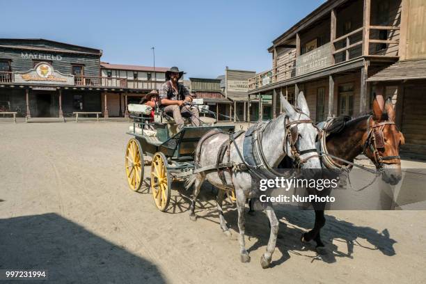 Car ride to visit the town. The actors themselves do figurative work and customer service in Almeria, Spain, on 30 June 2018. Western films as...