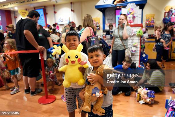 Isaac 8, and his brother Cruz 5, Chairez of Green Valley Ranch pose with their bears before leaving the Build-A-Bear store at Park Meadows Mall....