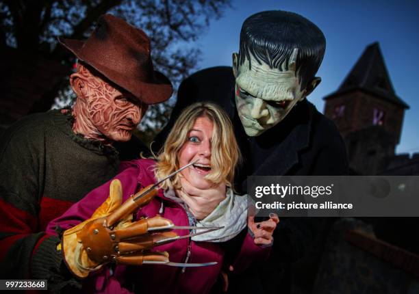 Freddy Krueger and Frankenstein hassle Birgit at the rehearsal for Halloween in Pfungstadt, Germany, 14 October 2017. The annual Halloween has been...