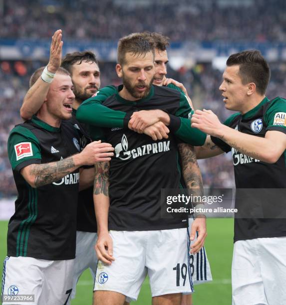 Schalke's goal getter Guido Burgstaller celebrates with his teammates Max Meyer, Daniel Caligiuri, Leon Goretzka and Yevhen Konoplyanka after scoring...