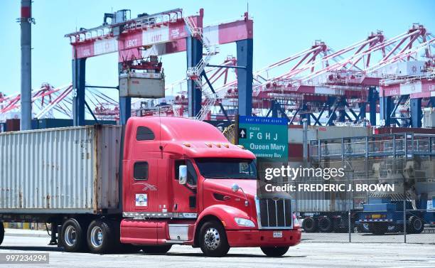 Container delivery truck heads for one of the terminals at the Port of Long Beach on July 12, 2018 in Long Beach, California, one of the world's...