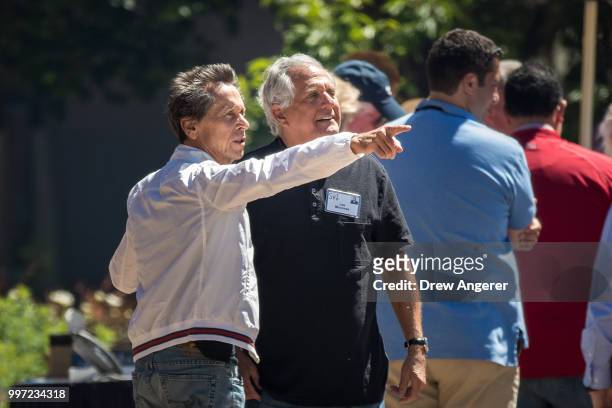 Brian Grazer, founder of Imagine Entertainment, talks with Leslie 'Les' Moonves, president and chief executive officer of CBS Corporation, during the...