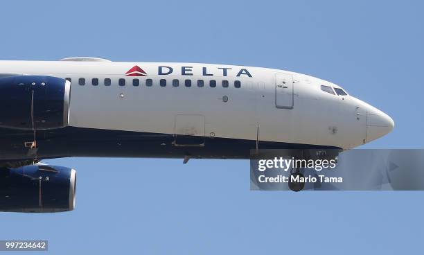 Delta Air Lines plane lands at Los Angeles International Airport on July 12, 2018 in Los Angeles, California. Delta announced today that it will...