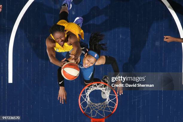 Nneka Ogwumike of the Los Angeles Sparks reaches for the ball against Maya Moore of the Minnesota Lynx on July 5, 2018 at Target Center in...