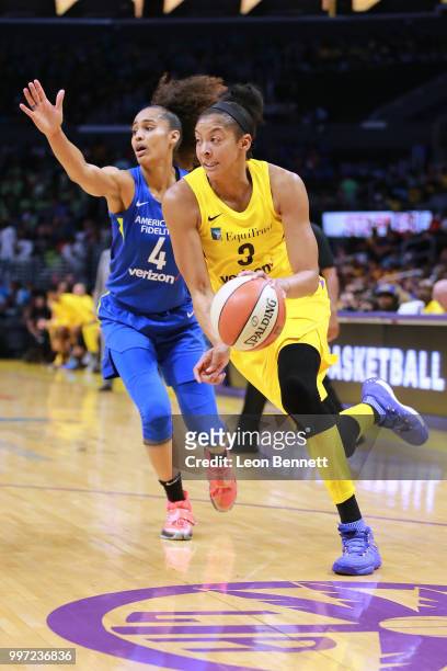 Candace Parker of the Los Angeles Sparks handles the ball against Skylar Diggins-Smith of the Dallas Wings during a WNBA basketball game at Staples...