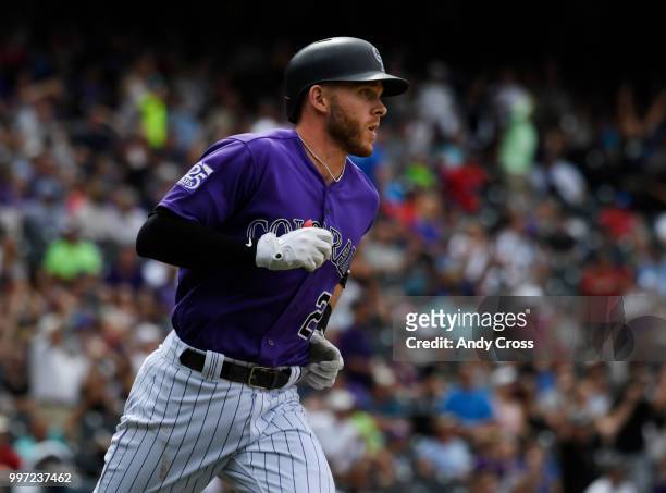 Colorado Rockies shortstop Trevor Story heads to first base after hitting a solo home run against the Arizona Diamondbacks in the 7th inning at Coors...