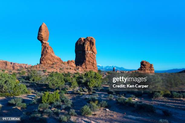 balanced rock and la sal mountains - sal stock pictures, royalty-free photos & images