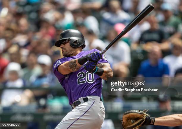 Ian Desmond of the Colorado Rockies takes a swing during an at-bat in a game against the Seattle Mariners at Safeco Field on July 7, 2018 in Seattle,...