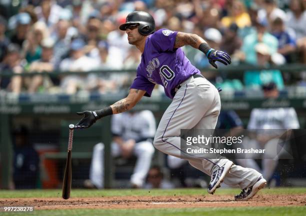 Ian Desmond of the Colorado Rockies hits a single during a game against the Seattle Mariners at Safeco Field on July 7, 2018 in Seattle, Washington....