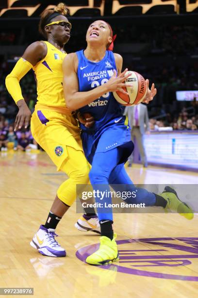 Aerial Powers of the Dallas Wings handles the ball against Essence Carson of the Los Angeles Sparks during a WNBA basketball game at Staples Center...