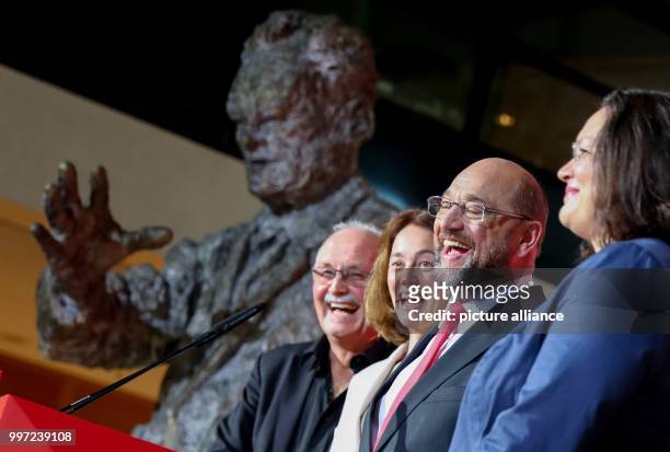 Dpatop - SPD party leader Martin Schulz speaking after the first projection at Willy-Brandt-Haus in Berlin, Germany, 15 October 2017. Beside him are...