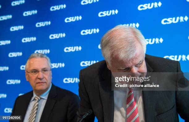 The head of the CSU Horst Seehofer and the Bavarian interior minister Joachim Herrmann attend a meeting of the party leadership in Munich, Germany,...