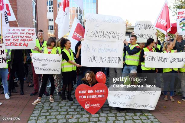 Employees of the bankrupt German aviation concern Air Berlin take part in a demonstration organised by the trade union Verdi against possible job...