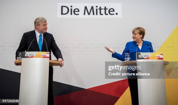 German chancellor and CDU leader Angela Merkel and the party's top candidate in yesterday's election in the state of Lower Saxony, Bernd Althusmann,...