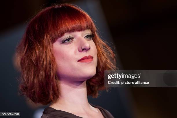 Model shows off the latest hairstyling trends at the Haare 2017 trade show in Nuremberg, Germany, 16 October 2017. Photo: Daniel Karmann/dpa