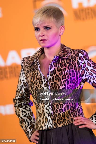 Model shows off the latest hairstyling trends at the Haare 2017 trade show in Nuremberg, Germany, 16 October 2017. Photo: Daniel Karmann/dpa