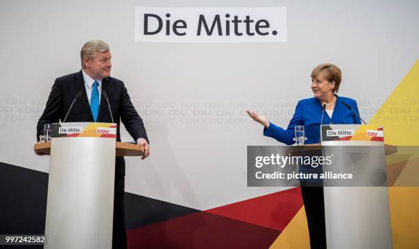 German Chancellor and leader of the Christian Democratic Union , Angela Merkel speaks during a party conference with the party's top candidate in in...