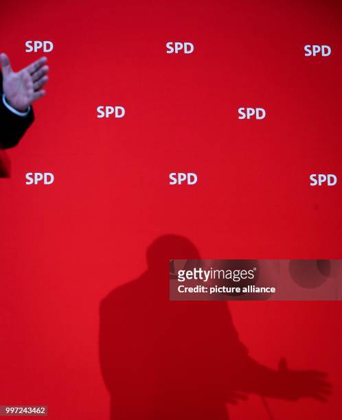 The shadow of the chairman of the German Social Democratic Party , Martin Schulz is seen as he speaks during a press conference at the SPD...