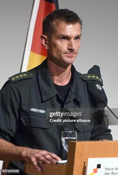 The commander of the GSG 9, Jerome Fuchs, speaks on stage during the ceremony of the elite Police Tactical Unit GSG 9 of the German Federal Police on...