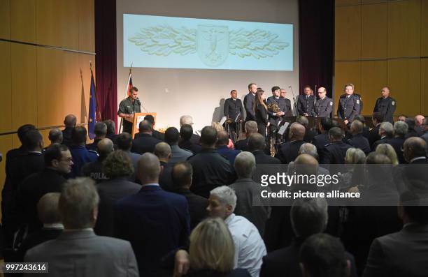 The commander of the GSG 9, Jerome Fuchs, asks the audience for a minutes silence for the officers killed in action during the ceremony of the elite...