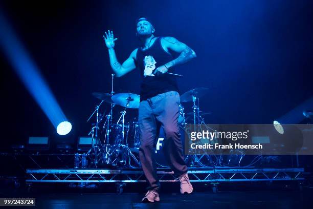 Puerto Rican rapper Rene Perez Joglar aka Residente performs live on stage during a concert at the Columbiahalle on July 12, 2018 in Berlin, Germany.