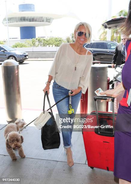 Kristin Chenoweth and her dog, Thunder are seen on July 12, 2018 in Los Angeles, California.