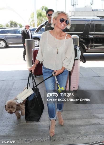 Kristin Chenoweth and her dog, Thunder are seen on July 12, 2018 in Los Angeles, California.