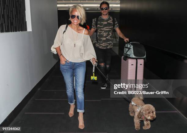 Kristin Chenoweth and her dog, Thunder are seen on July 12, 2018 in Los Angeles, California.