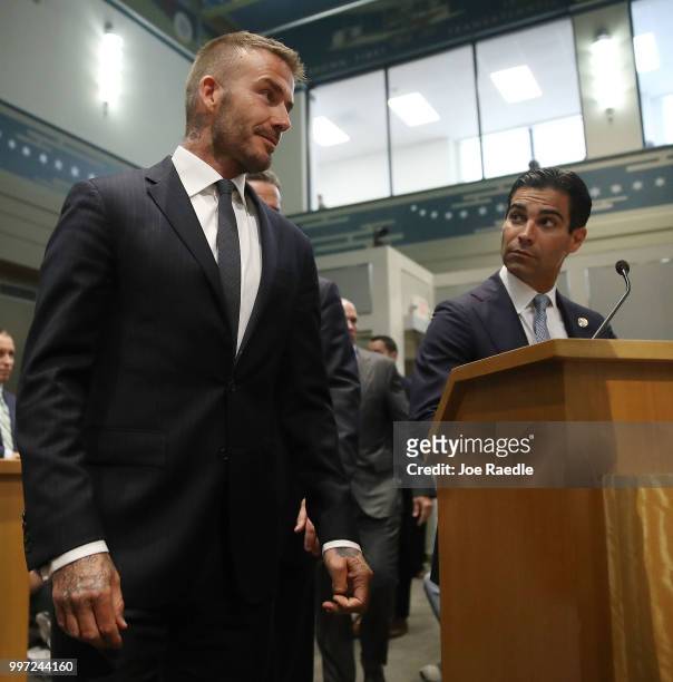 City of Miami Mayor Francis Suarez looks on as David Beckham arrives for a meeting at the Miami City Hall during a public hearing about building a...