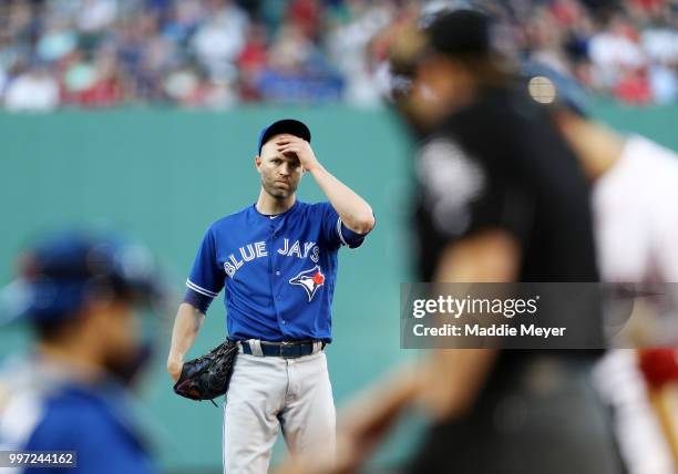 Happ of the Toronto Blue Jays reacts during the first inning against the Boston Red Sox at Fenway Park on July 12, 2018 in Boston, Massachusetts.