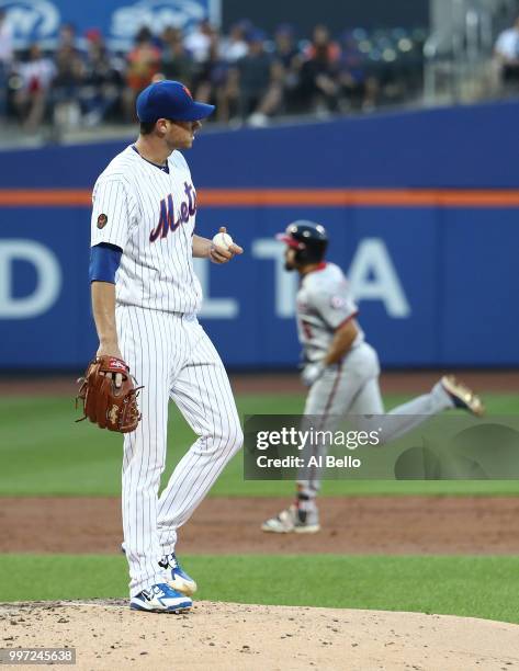 Anthony Rendon of the Washington Nationals rounds the bases after hitting a home run against Steven Matz of the New York Mets in the third inning...