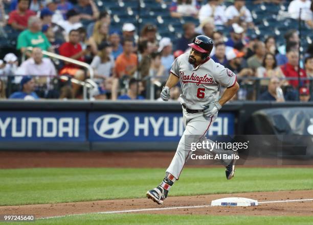 Anthony Rendon of the Washington Nationals rounds the bases after hitting a home run against Steven Matz of the New York Mets in the third inning...