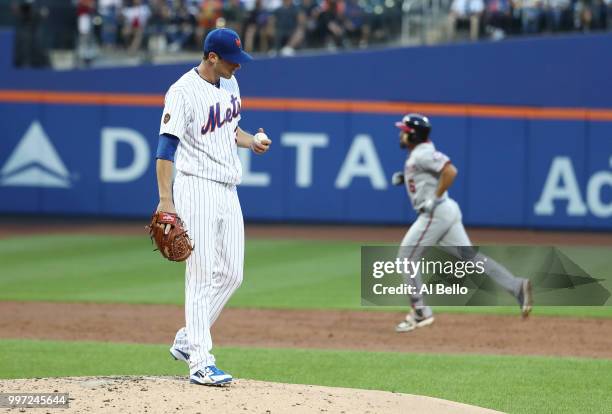 Anthony Rendon of the Washington Nationals rounds the bases after hitting a home run against Steven Matz of the New York Mets in the third inning...