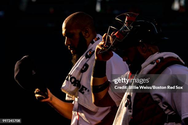 David Price and Sandy Leon of the Boston Red Sox walk toward the dugout before a game against the Toronto Blue Jays on July 12, 2018 at Fenway Park...