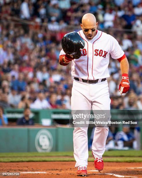 Steve Pearce of the Boston Red Sox reacts after being hit by a pitch during the first inning of a game against the Toronto Blue Jays on July 12, 2018...