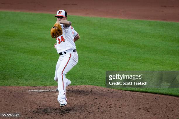 Kevin Gausman of the Baltimore Orioles pitches against the Philadelphia Phillies during the fourth inning at Oriole Park at Camden Yards on July 12,...