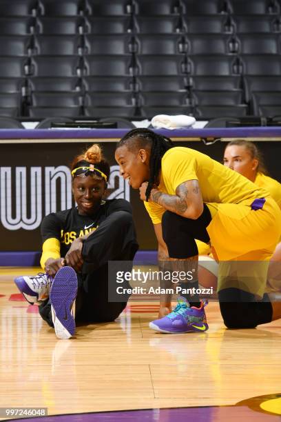 Essence Carson of the Los Angeles Sparks and Riquna Williams of the Los Angeles Sparks stretch before the game against the Dallas Wings on July 12,...